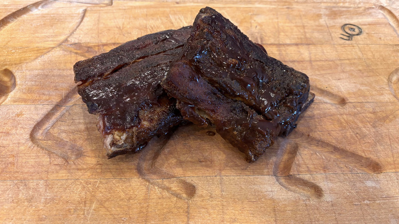 Texas Roadhouse baby back ribs on wooden cutting board