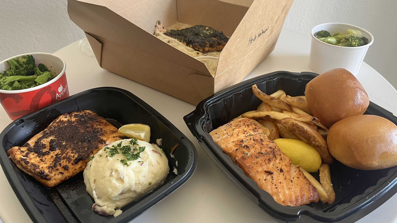 different restaurant salmon dishes on a table