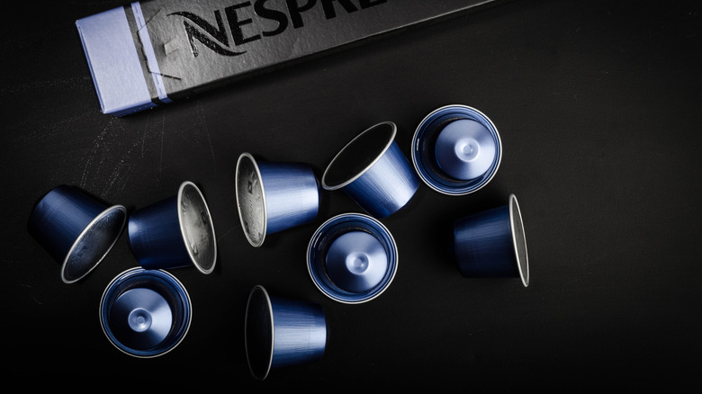 Blue Nespresso Original capsules on black background