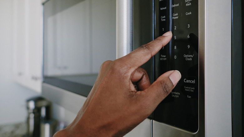 Foodie using a home microwave