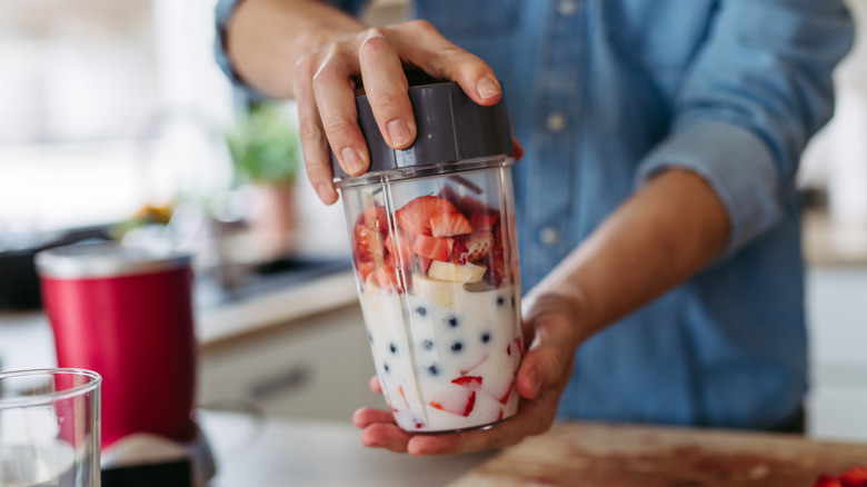 Home cook preparing a smoothie