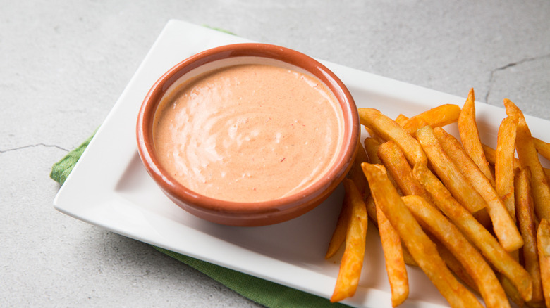 mayo and fries on table