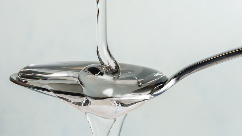 corn syrup pouring on a spoon