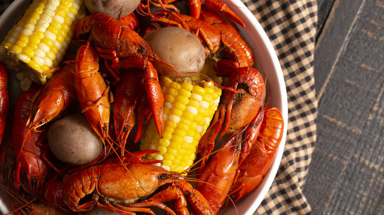 boiled crawfish, corn on the cob, and potatoes