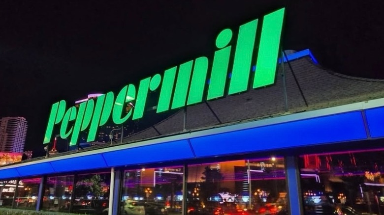 Green neon Peppermill sign on the roof
