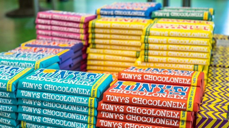 Stacks of multi-colored Tony's Chocolonely chocolate bars