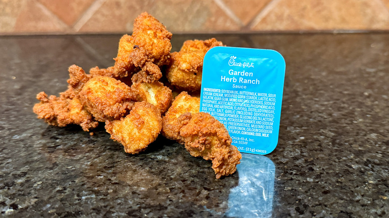 Package of Chick-fil-A Garden Herb Ranch Sauce and chicken nuggets