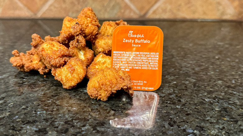 Package of Chick-fil-A Zesty Buffalo Sauce and chicken nuggets